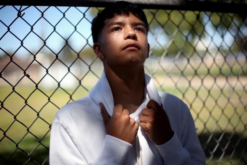 LOS ANGELES, CA - AUGUST 10: Andrew Diaz poses for a portrait a couple weeks before the start of the school year where he will be an 11th grader in Lynwood Park on Monday, Aug. 10, 2020 in Los Angeles, CA. The unparalleled disruption of California schools has had profound impacts on students in high-poverty communities. Diaz did not receive a computer to work from home until more than a month after the shutdown and struggled to find motivation to complete schoolwork without the in person interaction. (Dania Maxwell / Los Angeles Times)