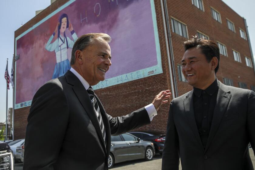 Los Angeles, CA - March 30: LA's mayoral candidate councilman Rick Caruso, left, received by Chairman Young Kim at his arrival at Korean American Federation on Wednesday, March 30, 2022 in Los Angeles, CA. (Irfan Khan / Los Angeles Times)