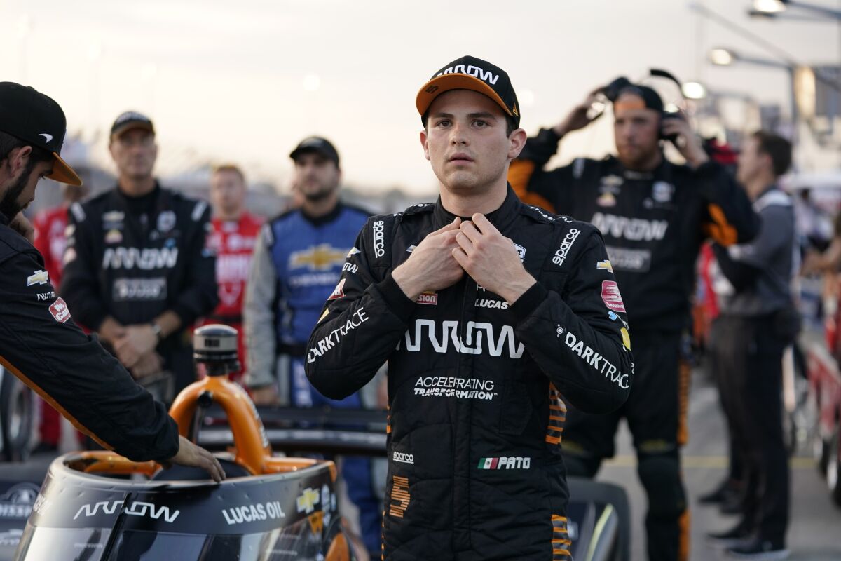 FILE - Pato O'Ward is shown before the start of an IndyCar auto race at World Wide Technology Raceway in Madison, Ill., Saturday, Aug. 21, 2021. Some 4,000 miles away from Indianapolis Motor Speedway, McLaren Racing on Friday, Feb. 11, 2022, unveiled the Formula 1 cars it will use this season in a splashy presentation at its Woking headquarters. The annual pageant had a twist: McLaren this year included its IndyCar, Extreme E and Esports teams in the show. McLaren's unveil showed the 2022 design of the Indy cars, which adds a splash of blue to the No. 5 driven by Pato O'Ward, and a lighter shade of blue than last year to the No. 7 driven by Felix Rosenqvist. (AP Photo/Jeff Roberson, File)