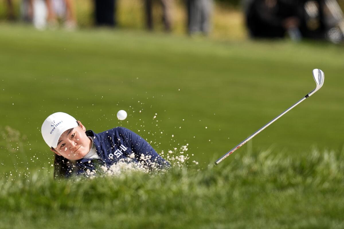 Allisen Corpuz hits from a bunker on the 12th hole during the final round of the U.S. Women's Open.