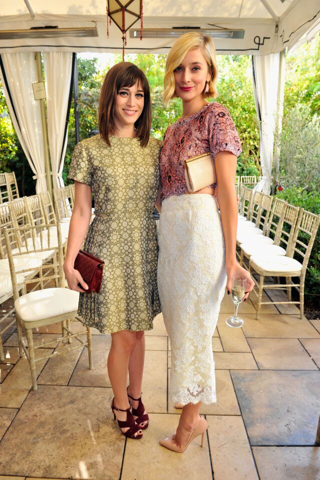 Actresses Lizzy Caplan and Caitlin FitzGerald attend the 2013 CFDA/Vogue Fashion Fund event. FitzGerald is wearing Irene Neuwirth jewelry.