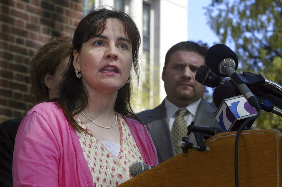 FILE — Lisa Miller answers questions about her custody battle during a news conference immediately following arguments for her case before the court at the State Capitol, April 17, 2008, in Richmond, Va. Miller, who fled the United States with her daughter in 2009 and lived as a fugitive to avoid sharing custody with her former same-sex partner, pleaded guilty Wednesday, Feb. 16, 2022, to parental kidnapping. (AP Photo/Lisa Billings, File)