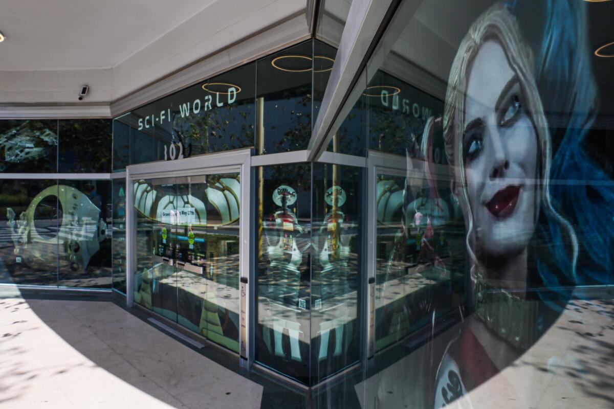An exterior view of the Sci-Fi World museum in Santa Monica, with a blown-up image of comic book character Harley Quinn.