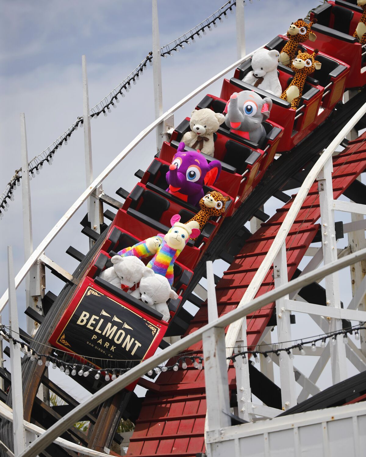 Stuffed animals ride the Giant Dipper roller coaster at Belmont Park in Mission Beach on June 1, 2020. 