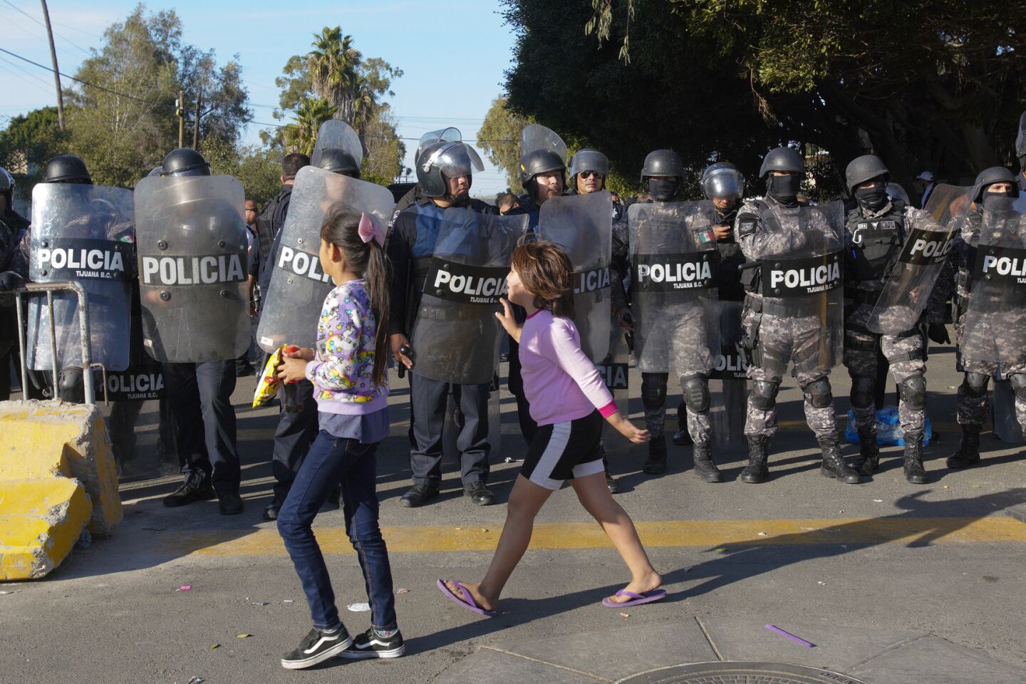 Anti-caravan protest starts peaceful, turns tense outside Tijuana shelter