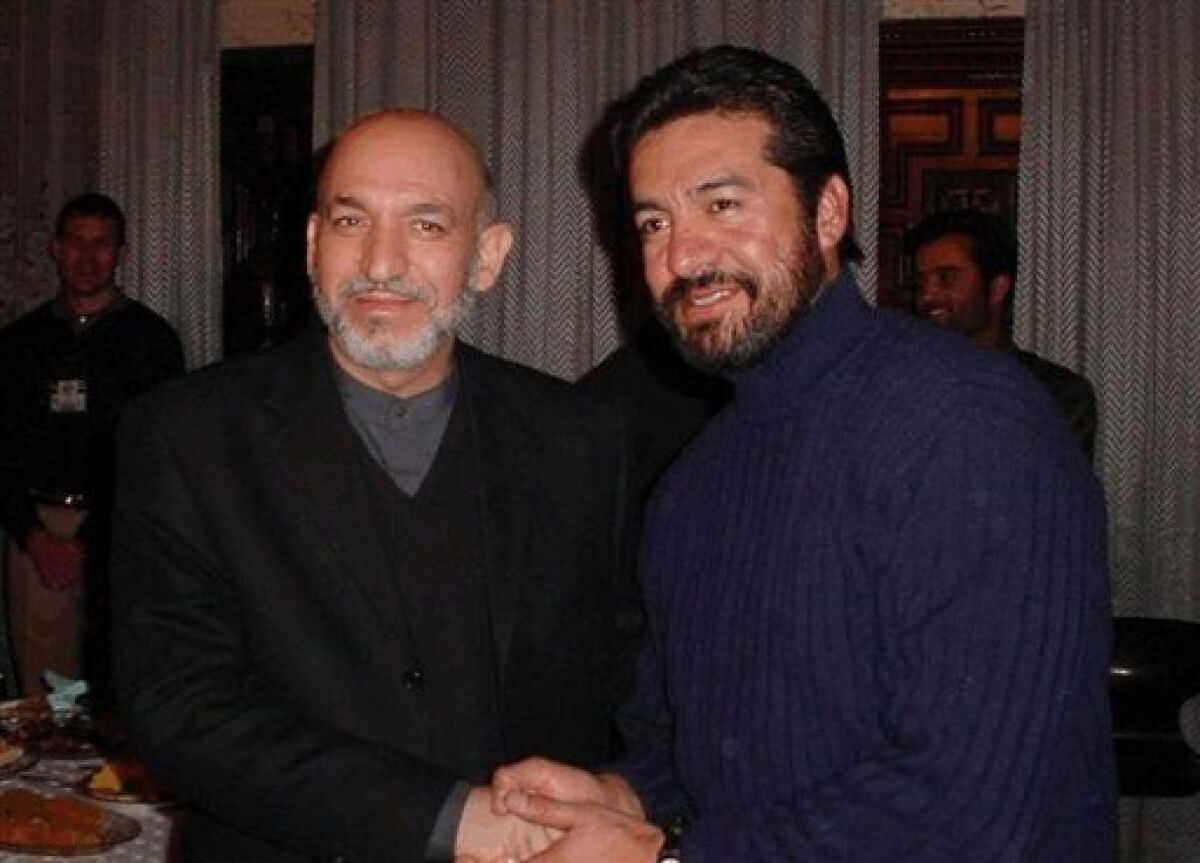 This undated photo made available Thursday, May 7, 2009 by the U.S. District Court shows Afghan President Hamid Karzai, left, and military contractor Don Ayala. On Friday, May 8, 2009, a judge must decide what is appropriate justice for Ayala, convicted of manslaughter while serving as a military contractor in Afghanistan. (AP Photo/US District Court)