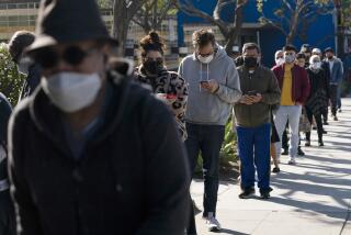 FILE - People wait in line for a COVID-19 test in Los Angeles, Tuesday, Jan. 4, 2022. Sixty-three percent of Black Americans and 68% of Hispanic Americans say they are at least somewhat worried about themselves or a family member being infected with COVID-19, compared to 45% of white Americans, according to an April poll from The Associated Press-NORC Center for Public Affairs Research. (AP Photo/Jae C. Hong, File)