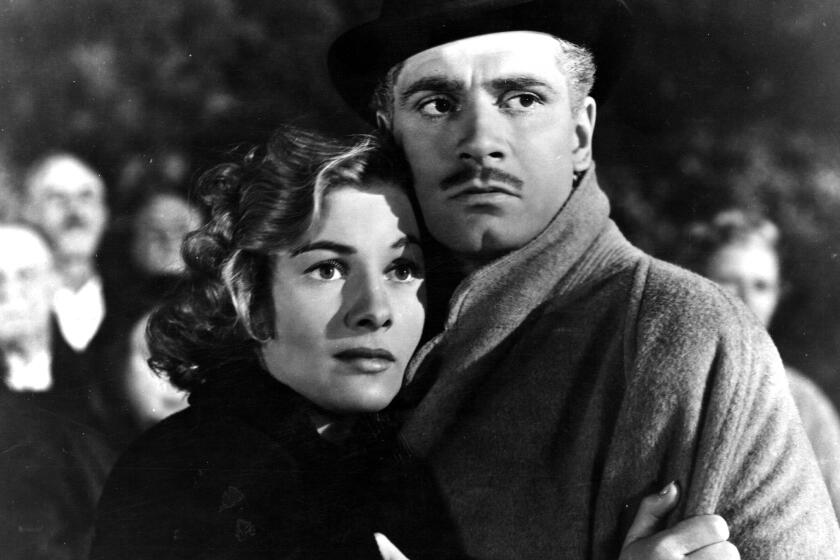 English actor and director Laurence Olivier (1907 - 1989) stars with Joan Fontaine