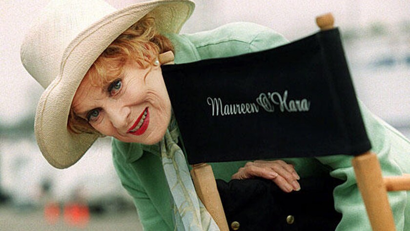 Veteran actress Maureen O'Hara poses by her cast chair on the set of a television movie filming at Santa Monica Pier, May 9, 2000, in Santa Monica, Calif. O'Hara with her flame red hair was the Queen of Technicolor in her heyday, and remained active at age 79.