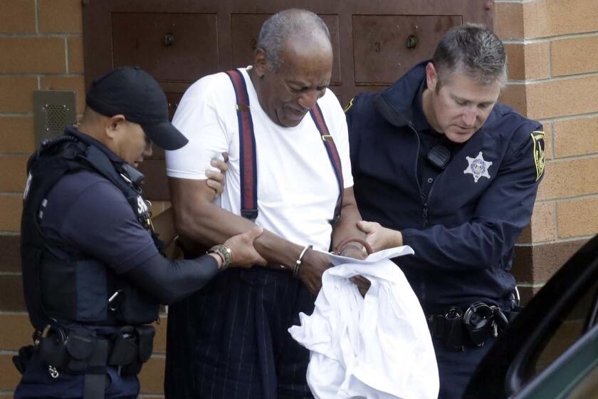 Bill Cosby is escorted out of the Montgomery County Correctional Facility, Tuesday Sept. 25, 2018, in Eagleville, Pa., following his sentencing to three-to-10-year prison sentence for sexual assault. (AP Photo/Jacqueline Larma)