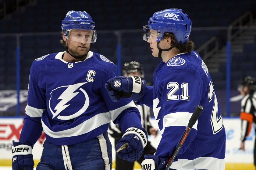 Tampa Bay Lightning center Brayden Point (21) celebrates his goal against the Detroit Red Wings with center Steven Stamkos (91) during the second period of an NHL hockey game Wednesday, Feb. 3, 2021, in Tampa, Fla. (AP Photo/Chris O'Meara)