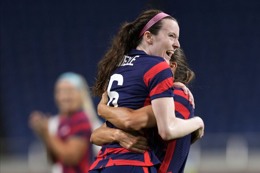 United States' Rose Lavelle, left, celebrates after scoring a goal during a women's soccer match against New Zealand at the 2020 Summer Olympics, Saturday, July 24, 2021, in Saitama, Japan. (AP Photo/Martin Mejia)