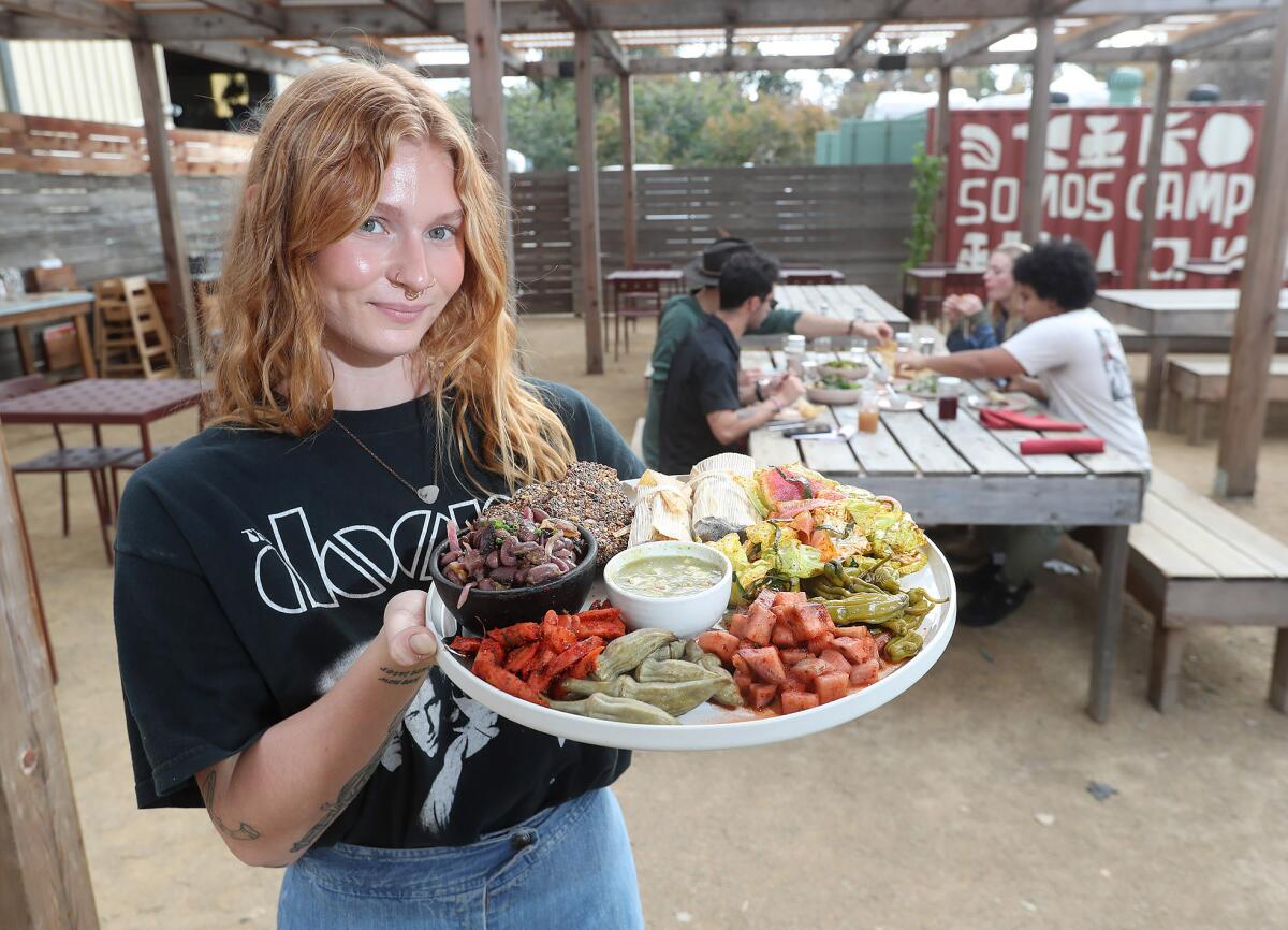 Barista Delaney Hayes brings out the Campesino "taste the farm" plate.