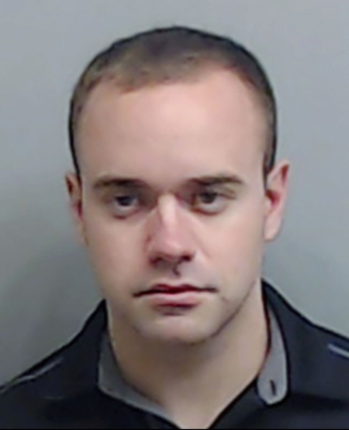 In this booking photo made available Thursday, June 18, 2020 by the Fulton County, Ga., Sheriff's Office, shows Atlanta Police Officer Garrett Rolfe. Rolfe, who fatally shot Rayshard Brooks in the back after the fleeing man pointed a stun gun in his direction, was charged with felony murder and 10 other charges. Rolfe was fired after the shooting. (Fulton County Sheriff's Office via AP)