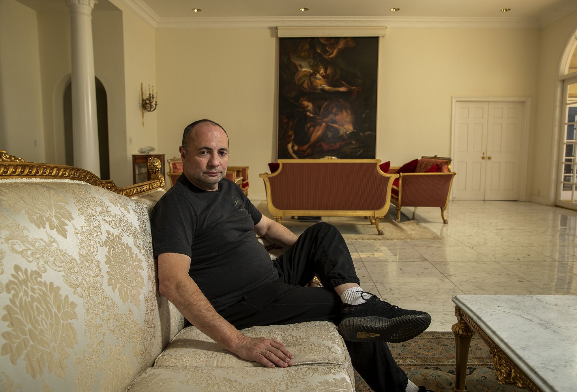 Ashot Yegiazaryan on a couch at his home in Beverly Hills.
