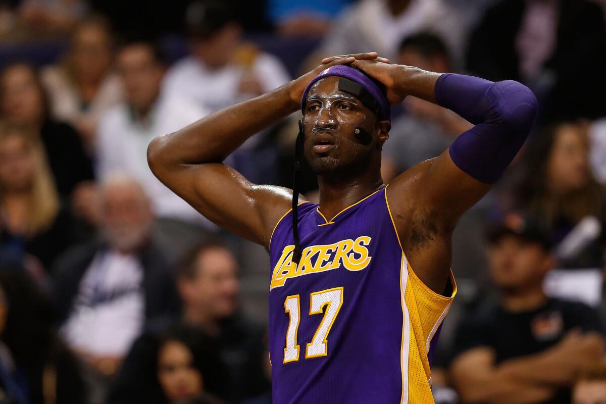 Lakers center Roy Hibbert reacts during the first half.