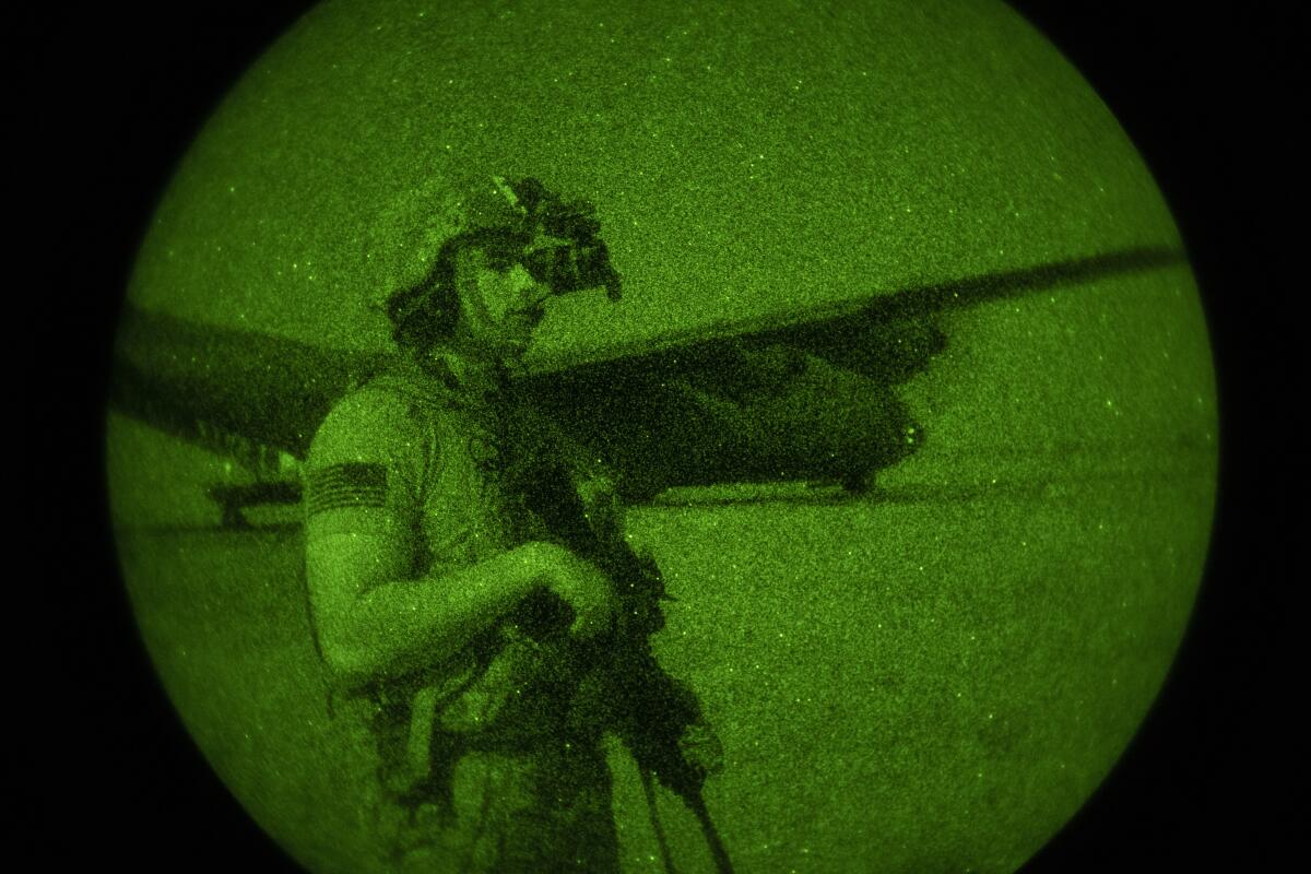 Army Spc. Dominic Deitrick seen through a night-vision device during a mission in Somalia in June.