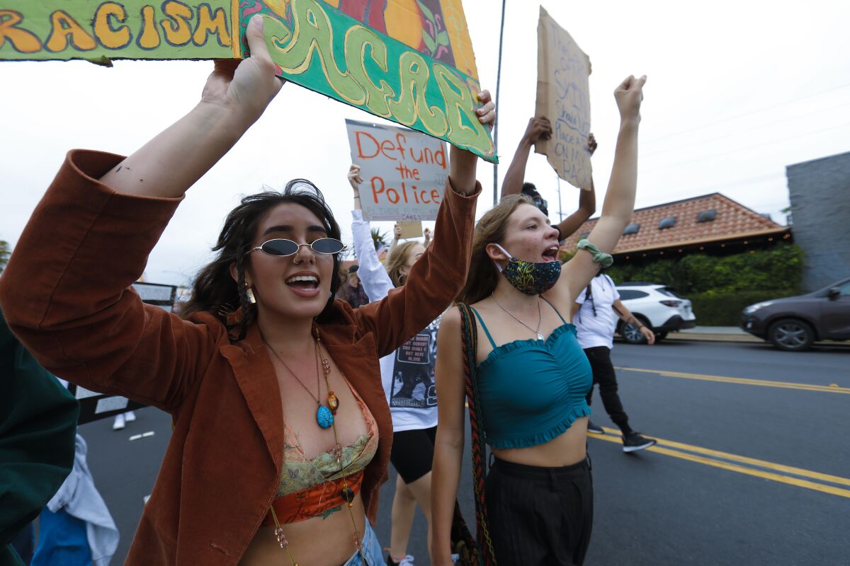 An estimated 400 protesters marched down Garnet Avenue in Pacific Beach on Wednesday showing support for Black Lives Matter. 