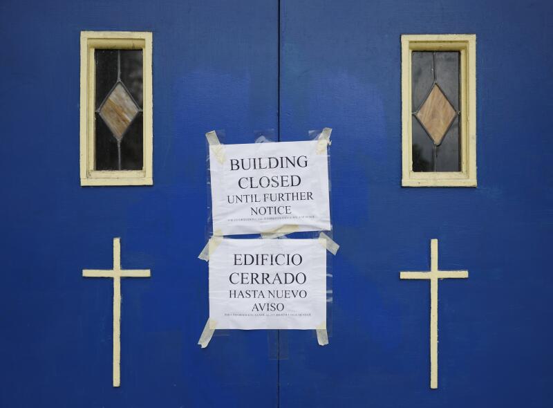 Notices are taped to the doors of Echo Park United Methodist Church, which has been a community beacon for 100 years.