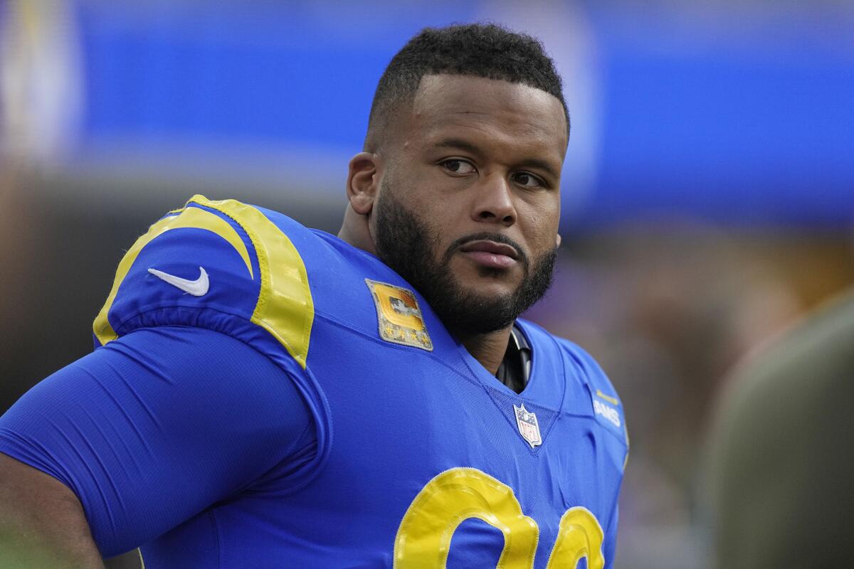 Rams defensive tackle Aaron Donald looks on from the sideline during a game.