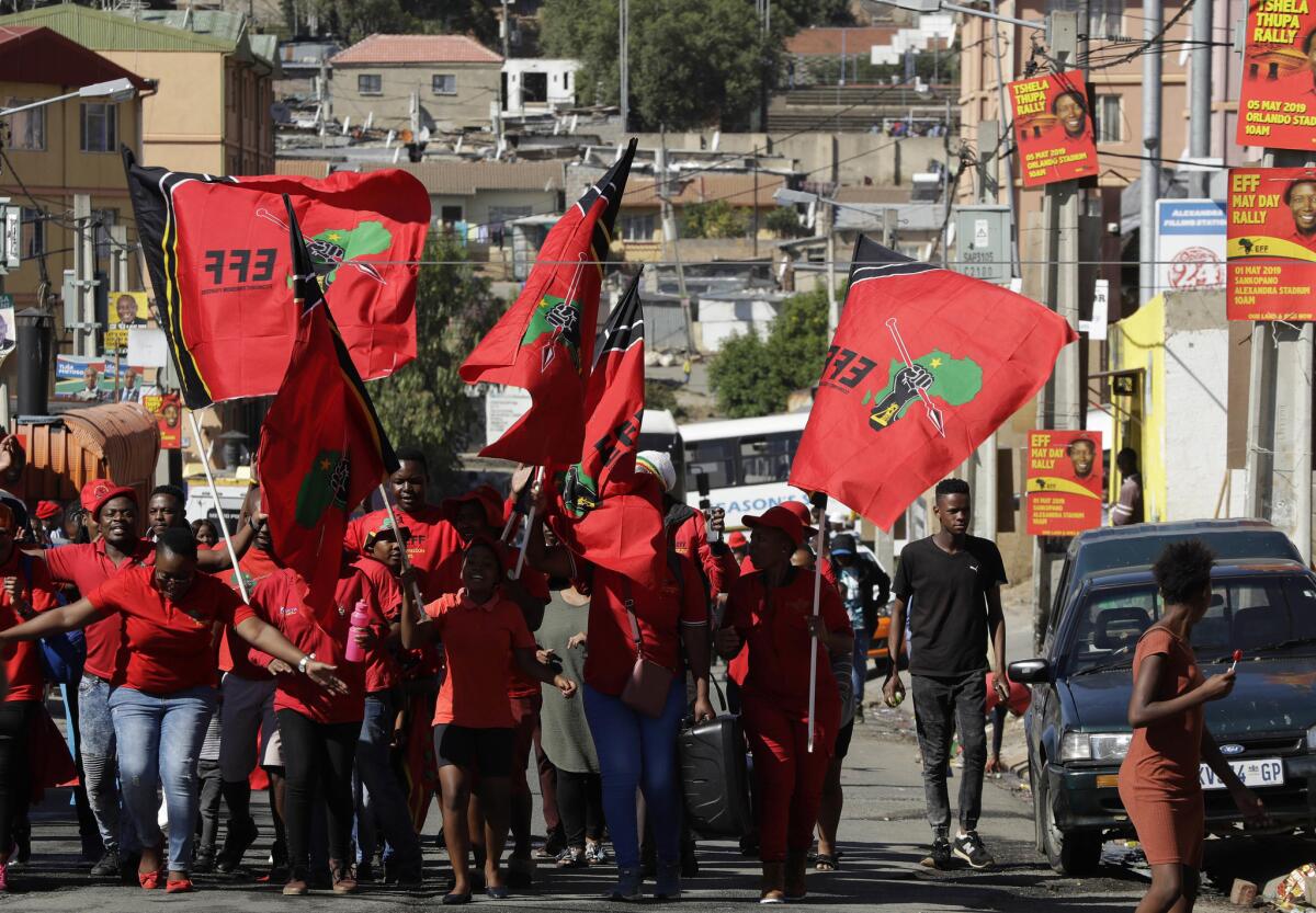 Members of the Economic Freedom Fighters (EFF) party make their way to attend a May Day Rally in Johannesburg, South Africa. (Themba Hadebe / Associated Press)