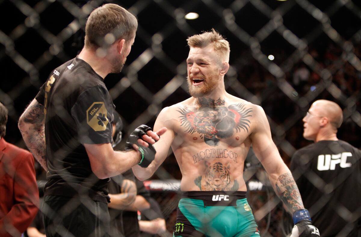 Conor McGregor reacts after his 13-second knockout of Jose Aldo during their featherweight title bout at UFC 194 on Saturday.