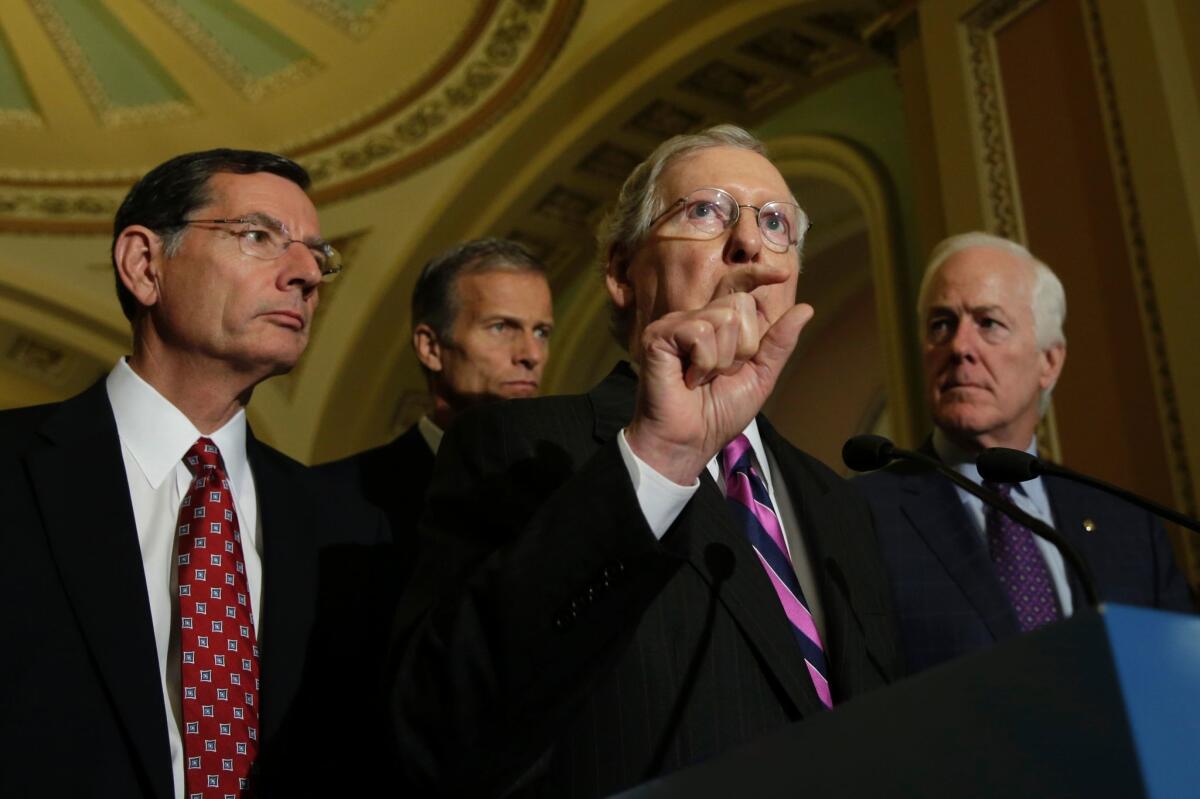 Senate Majority Leader Mitch McConnell, center, with Republican leaders Tuesday in the Capitol.