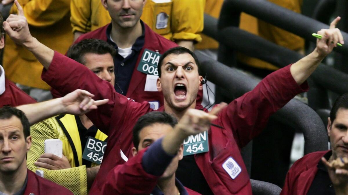 The suddenly volatile financial markets are giving traders, like this guy at the Chicago Mercantile Exchange, a reason to celebrate.