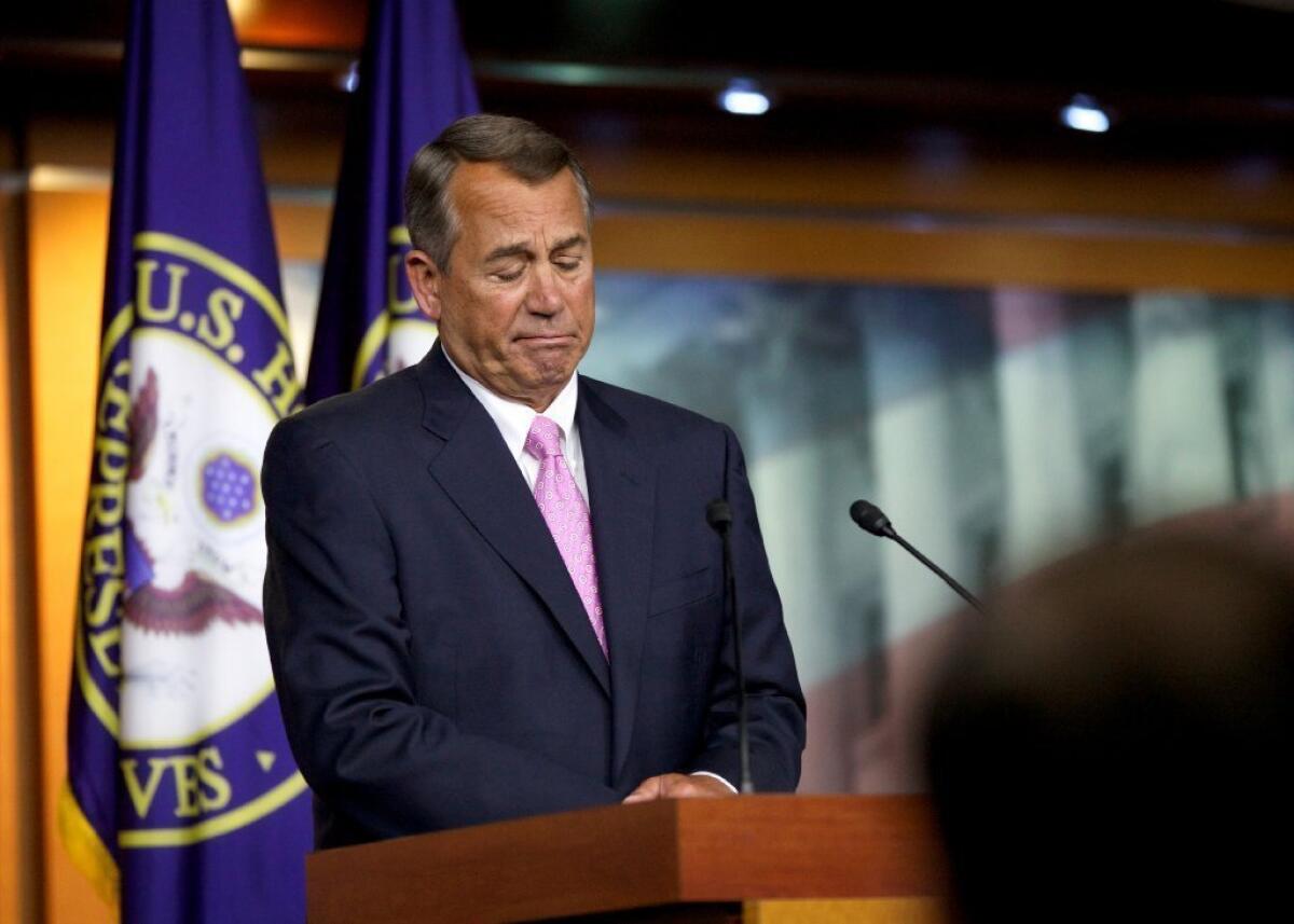 House Speaker John A. Boehner (R-Ohio) listens to a reporter's question during a news conference Thursday on Capitol Hill.