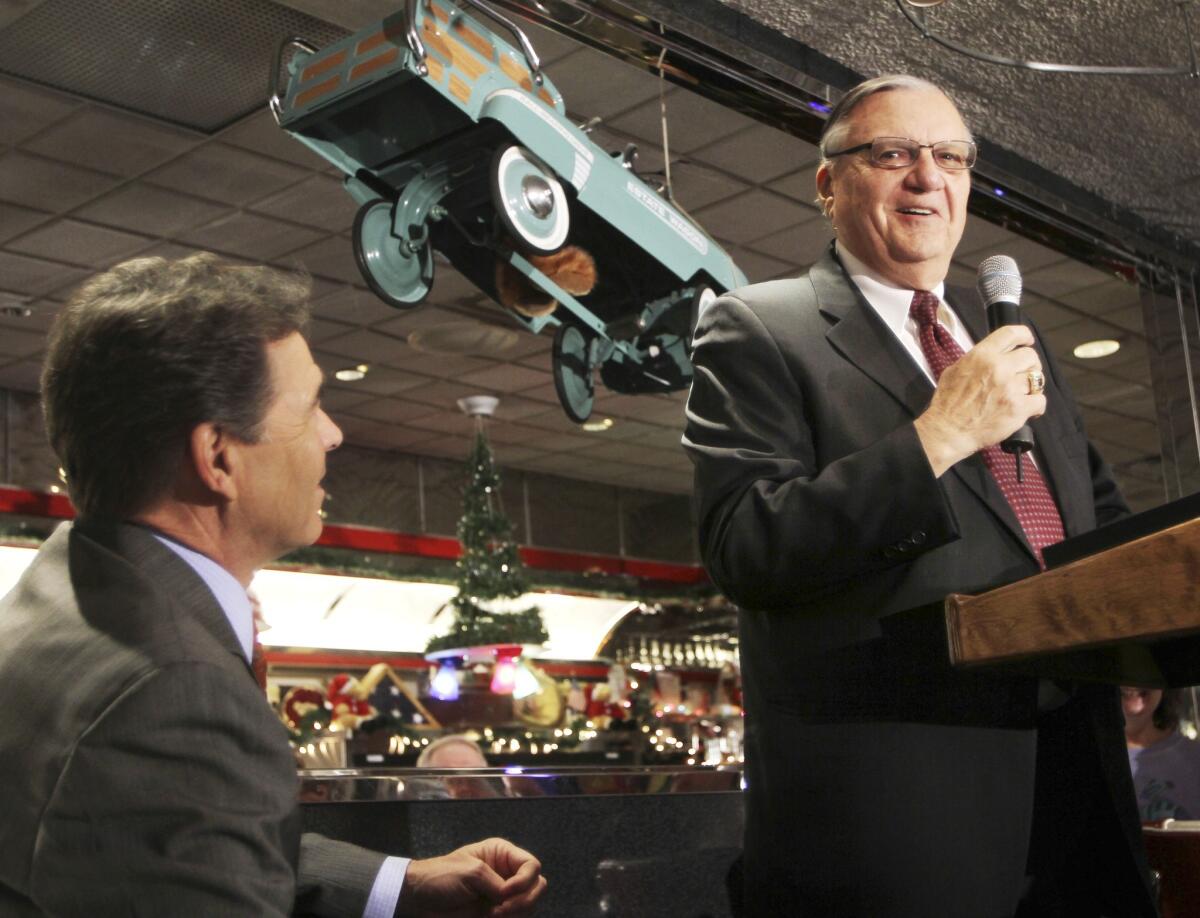 Sheriff Joe Arpaio of Maricopa County, Ariz., speaks on behalf of Texas Gov. Rick Perry at a campaign stop at Joey's Diner in Amherst, N.H., on Tuesday.