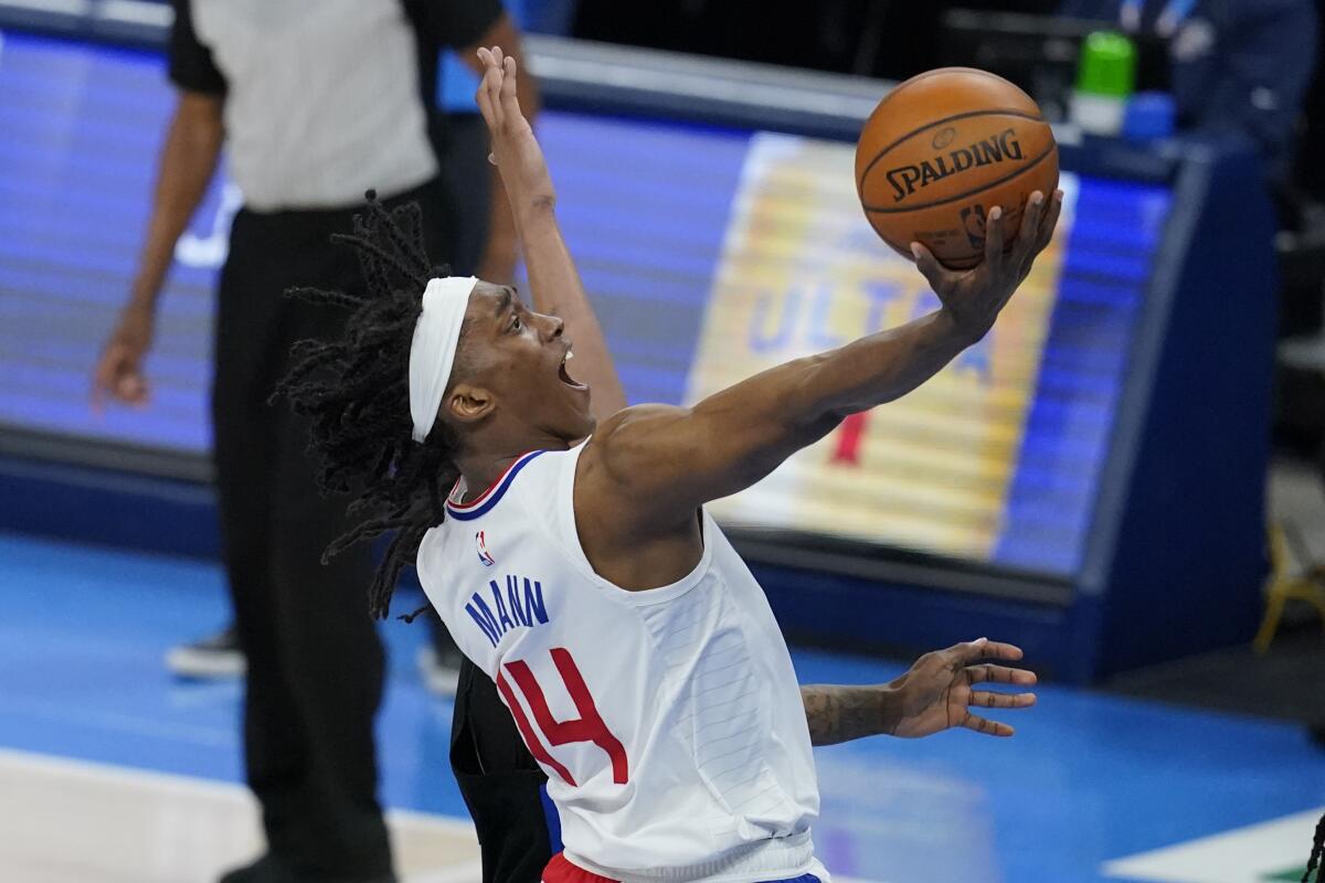 Clippers guard Terance Mann puts up a shot against the Oklahoma City Thunder on Sunday.