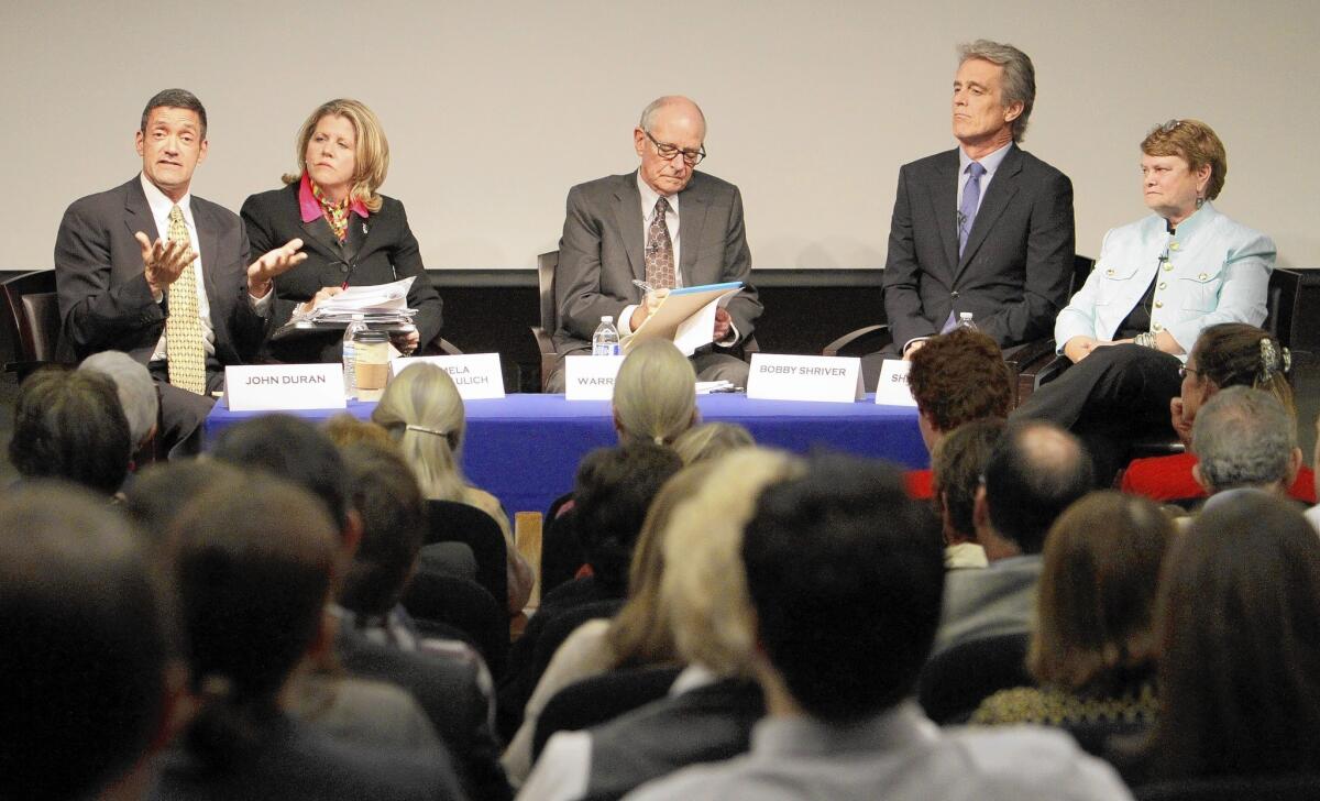 Supervisorial candidate John Duran, left, talks during the debate at UCLA. With him are candidate Pamela Conley Ulich, moderator Warren Olney, and county race hopefuls Bobby Shriver and Sheila Kuehl.