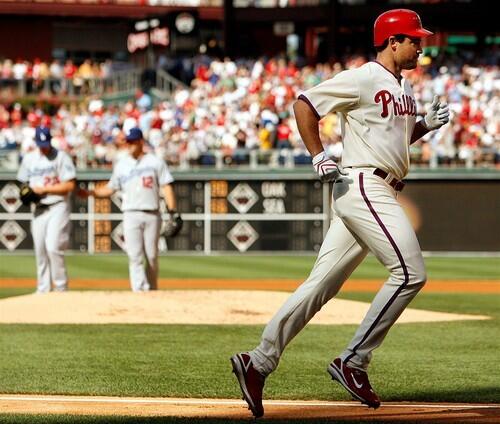 Pat Burrell heads home after hitting a three-run home run off of Clayton Kershaw in the first inning.