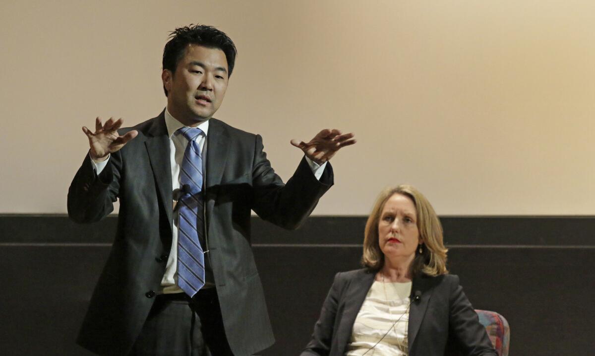 Los Angeles City Council District 4 candidates David Ryu, left, and Carolyn Ramsay face off at a debate held by the Los Feliz Improvement Association on April 27.
