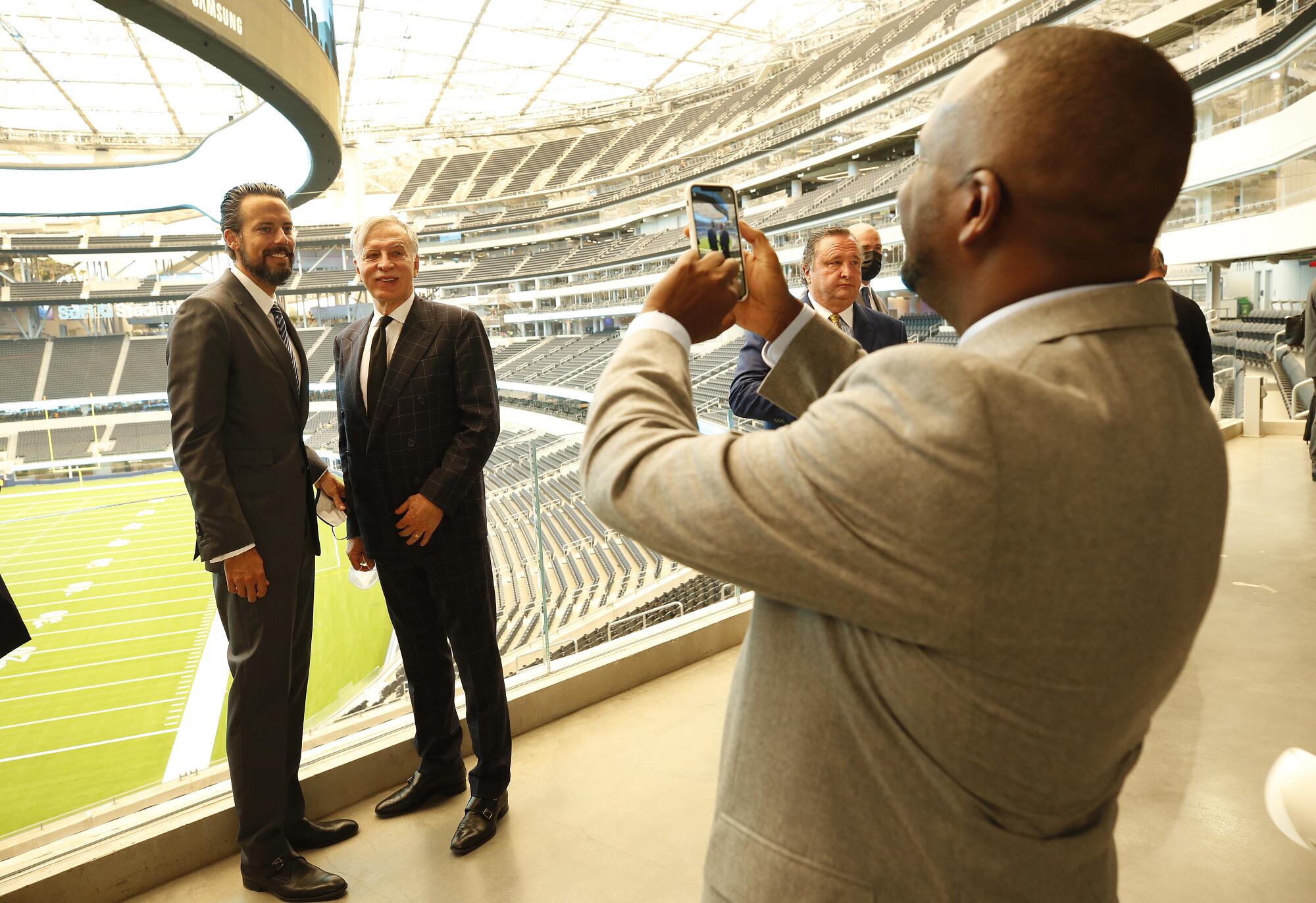 Rams owner Stan Kroenke, with his son, Josh Kroenke, left, during the official opening of SoFi Stadium.