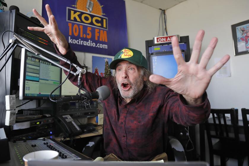 DJ Jim "Poorman" Trenton gets animated as he host's "Poorman's Morning Rush" show at KOCI Radio on Monday. The Poorman will host a marathon 29-hour broadcast party that will start on New Year's Eve and run though New Year's Day to ring in the new year.