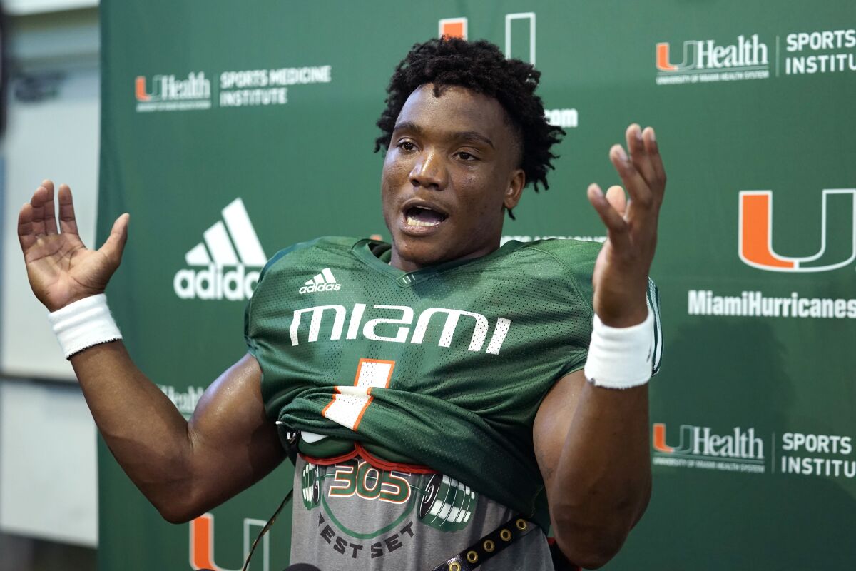 Miami starting quarterback D'Eriq King speaks with the news media after a NCAA college football practice, Tuesday, Aug. 31, 2021, in Coral Gables, Fla.(AP Photo/Lynne Sladky)
