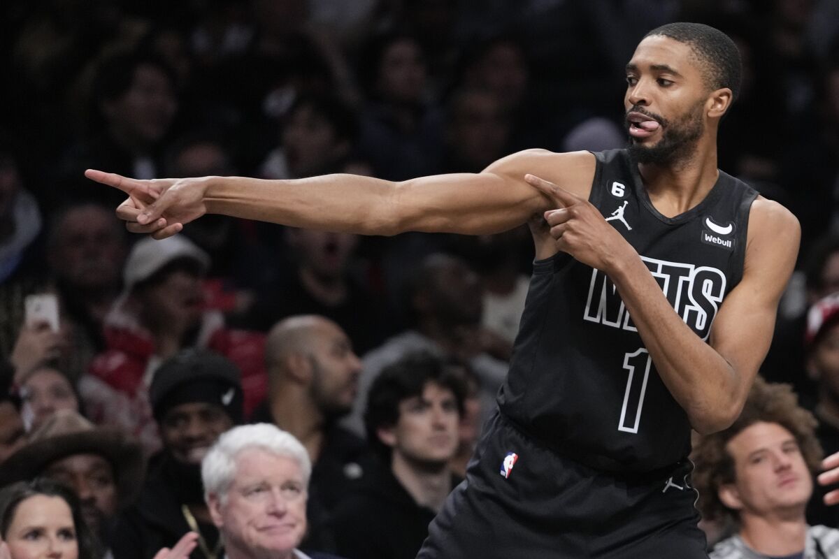 Brooklyn Nets forward Mikal Bridges reacts after scoring against against the Atlanta Hawks during the second half of an NBA basketball game Friday, March 31, 2023, in New York. The Nets won 124-107. (AP Photo/Mary Altaffer)