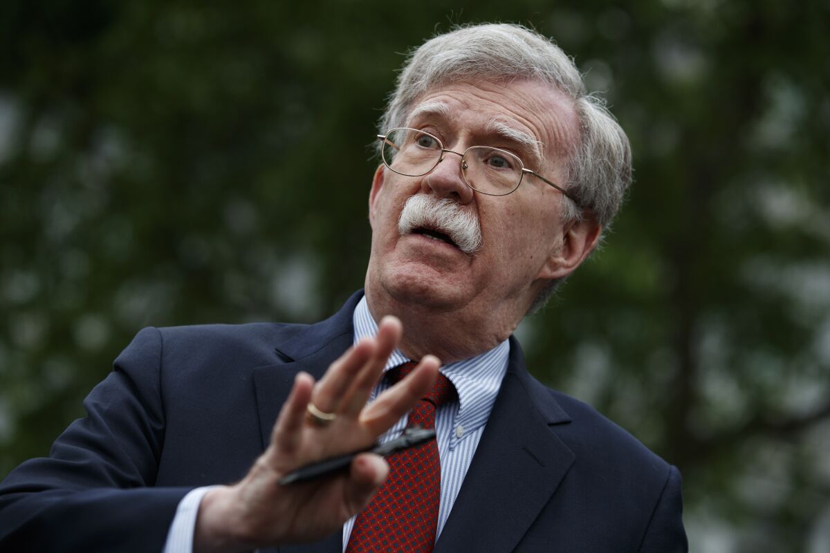 Then-national security advisor John Bolton talks to reporters outside the White House on May 1.