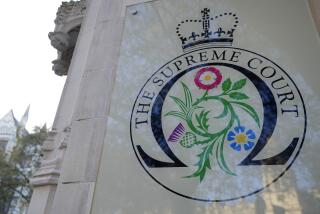 A view of the entrance of the Supreme Court in London, Wednesday, Nov. 15, 2023. Britain's highest court is set to rule Wednesday, Nov. 15 on whether the government's plan to send asylum-seekers to Rwanda is legal, delivering a boost or a blow to a contentious central policy of Prime Minister Rishi Sunak's administration. Five justices on the U.K. Supreme Court will deliver judgment in the government's attempt to overturn a lower court ruling that blocked deportations. (AP Photo/Kirsty Wigglesworth)