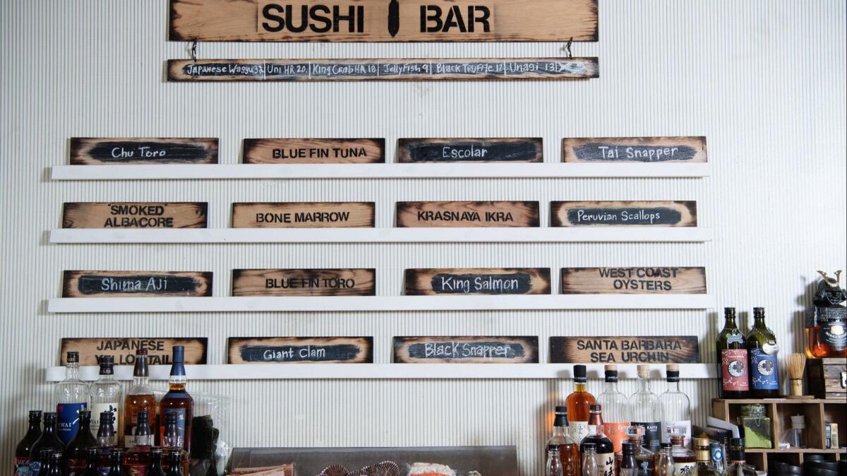 The menu at Sushi Bar is posted behind the bar.