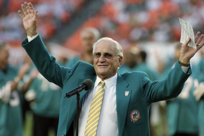 FILE - In this Oct. 25, 2009, file photo, former Miami Dolphins head coach Don Shula waves to the crowd during a half time ceremony of an NFL football game between the Miami Dolphins and the New Orleans Saints in Miami. Shula, who won the most games of any NFL coach and led the Miami Dolphins to the only perfect season in league history, died Monday, May 4, 2020, at his South Florida home, the team said. He was 90. (AP Photo/Jeffrey M. Boan)