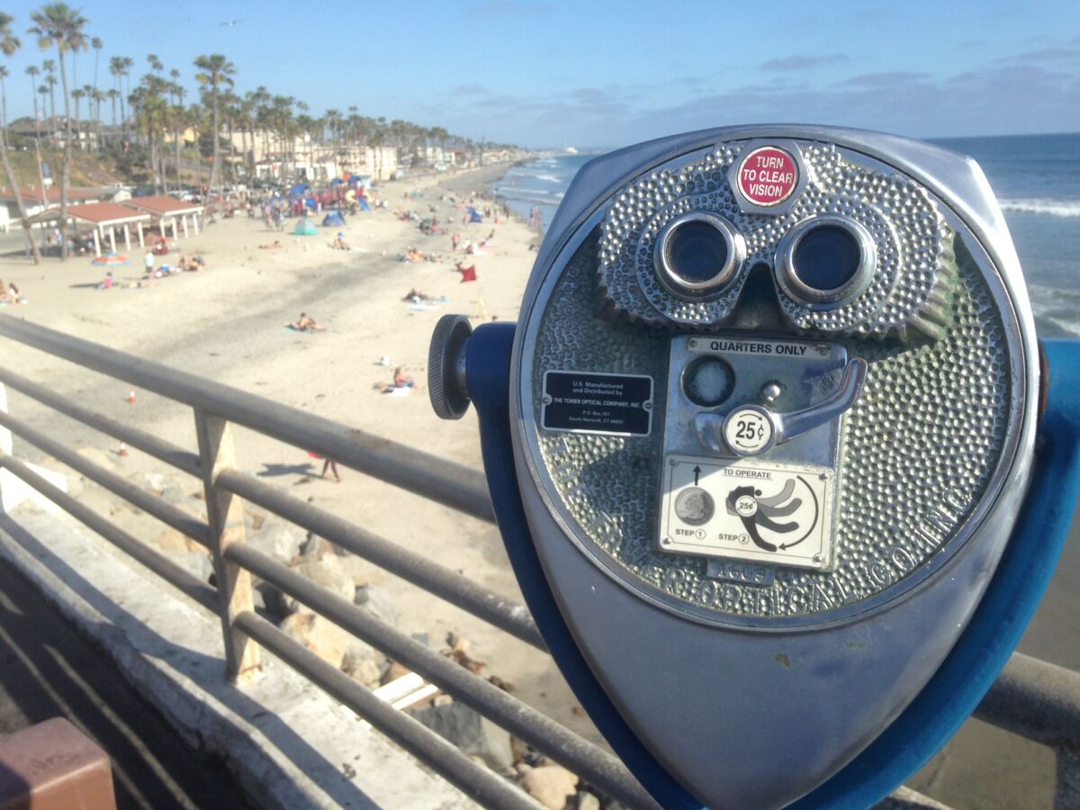 A coin-operated binocular awaits quarters on the Oceanside pier.