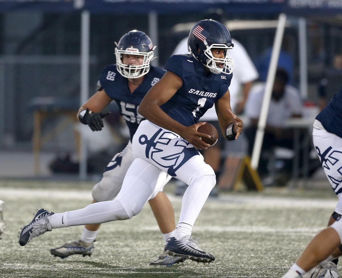 Newport Harbor quarterback Jaden O'Neal (1) scrambles into the open field against Tesoro at Davidson Field on Thursday.