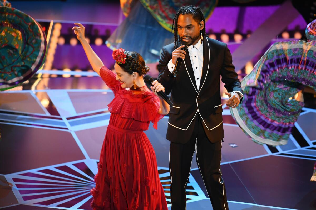 Natalia Lafourcade, left, and Miguel.