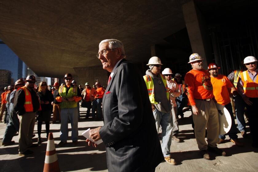 LOS ANGELES, CA - JANUARY 08, 2013: Philanthropist Eli Broad is surrounded by union construction workers as officials attended the topping-out ceremony commemorating the placement of the steel beams in the framing of The Broad Museum located at the corner of Grand Avenue and Second Street in downtown Los Angeles on January 08, 2013. (Al Seib / Los Angeles Times)