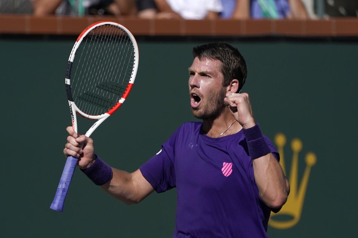 Cameron Norrie reacts after defeating Grigor Dimitrov in a semifinal match at the BNP Paribas Open on Oct. 16, 2021.