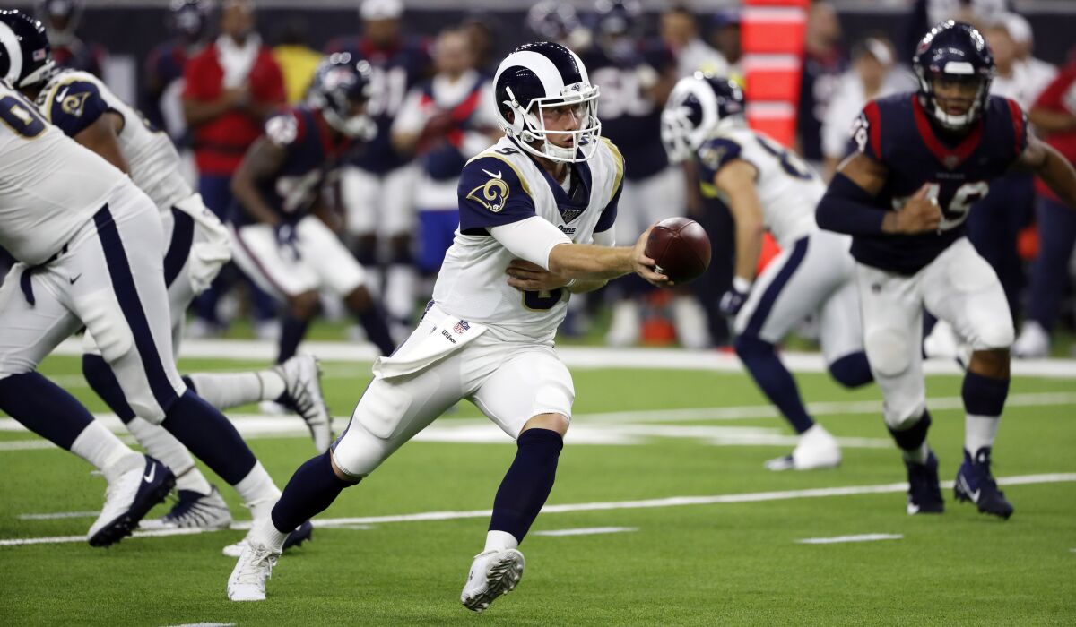 Rams practice squad quarterback John Wolford, shown in a preseason victory over the Houston Texans, did his best to imitate the Ravens' Lamar Jackson in preparation for the Monday matchup.
