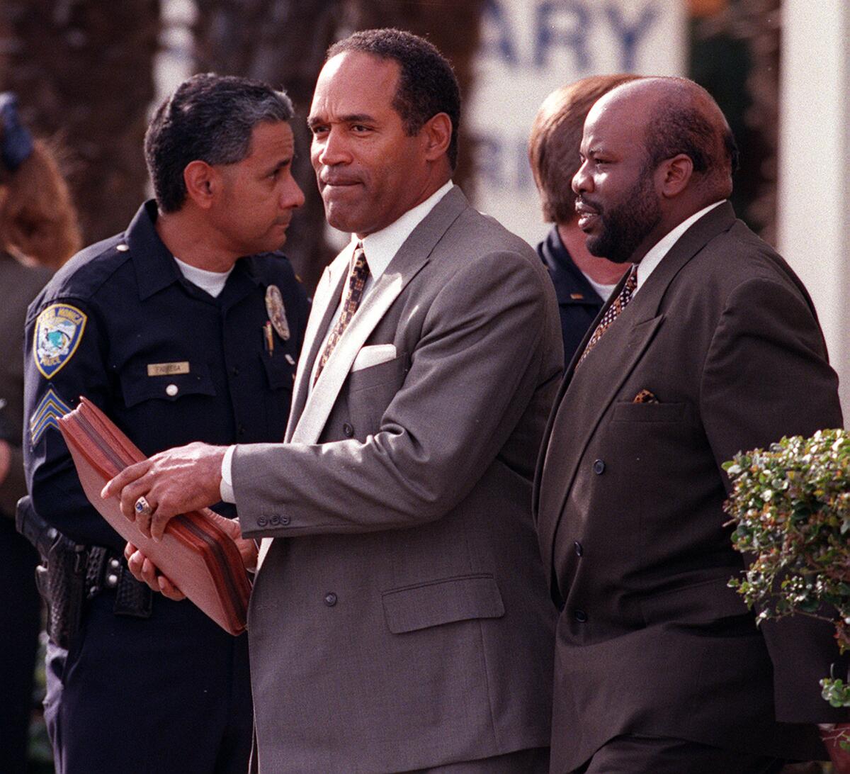 O.J. Simpson leaves a Santa Monica courthouse after his civil trial ended and the jury began deliberations on Jan. 18, 1997.