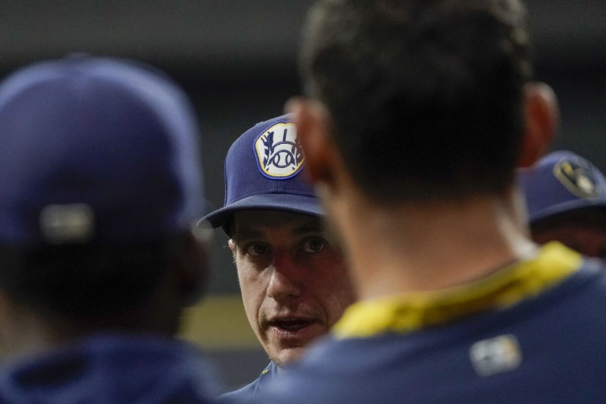 Milwaukee Brewers manager Craig Counsell talks to his players at a practice for the Game 1 of the NLDS baseball game Tuesday, Oct. 5, 2021, in Milwaukee. The Brewers plays the Atlanta Braves in Game 1 on Friday, Oct. 8, 2021. (AP Photo/Morry Gash)